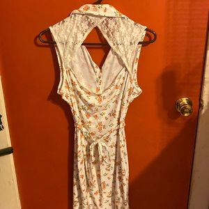 Cute white dress with floral print and open back